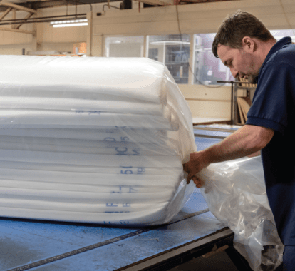 Man packing air filters for the Air Filtration department