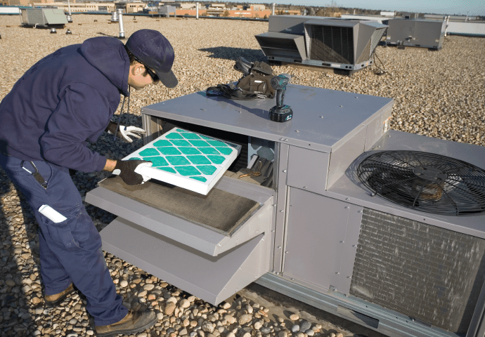 Man installing HVAC - Air Filtration Solutions by Beta Group