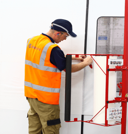 Man in a spray booth carrying out works - Performance and Safety for Spraybooths: Housekeeping