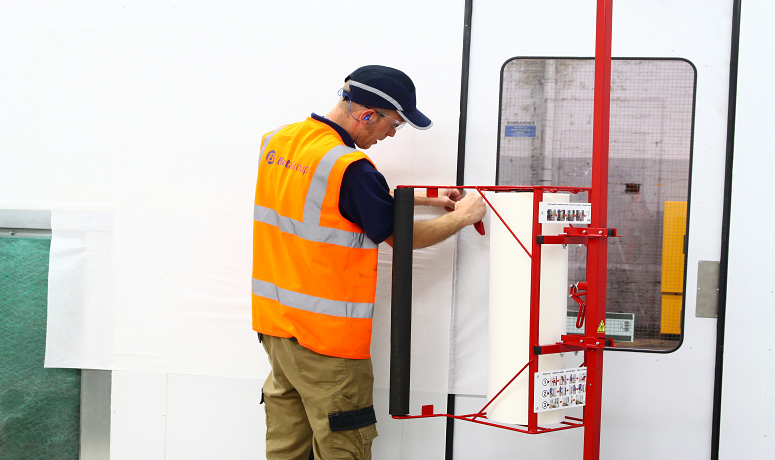 Man in a spray booth carrying out works - Performance and Safety for Spraybooths: Housekeeping