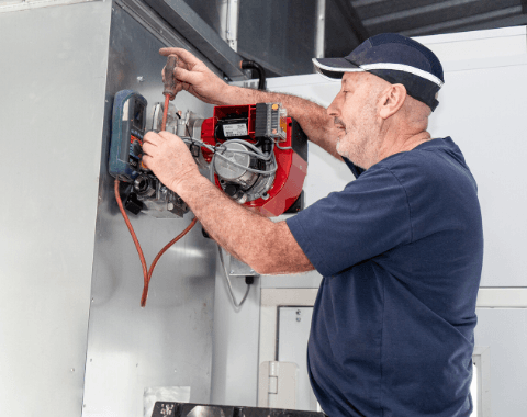 Electrical works being carried out inside a spray booth - Spray Booth Servicing & Maintenance Beta Group