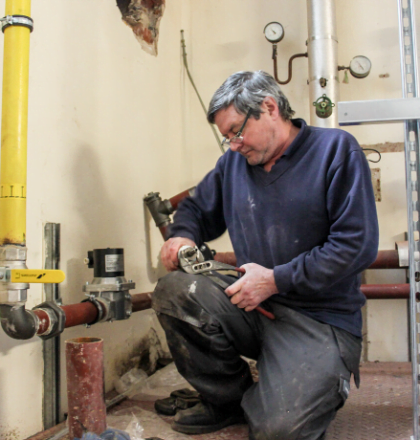 Man carrying out plumbing works - Now is the Time to Undertake Building Maintenance, Mechanical & Electrical Services