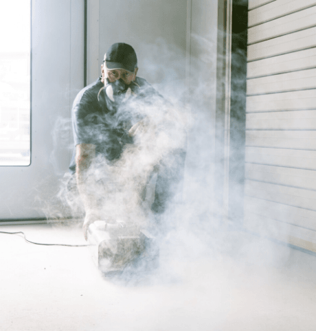 Man with smoke clearing machine to help Improve the Safety of a Spray Booth: Thorough Examination & Testing of LEV Systems Mobile Banner