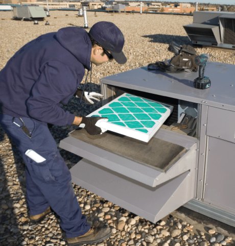 Engineer Installs HVAC Air Filter into Air Conditioning Systems